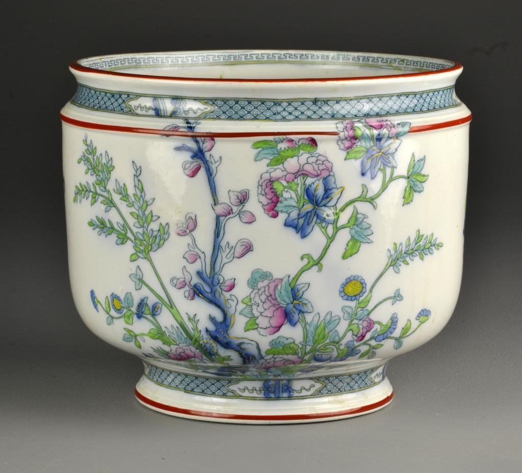 A Hancock & Sons English Porcelain Jardiniere: A porcelain planter finely painted with chrysanthemums and flower sprays, underside hallmarked in underglaze blue for Hancock & Sons, Royal Coronaware, Indian Tree, measures 8.4"H x 9.5"D, circa early