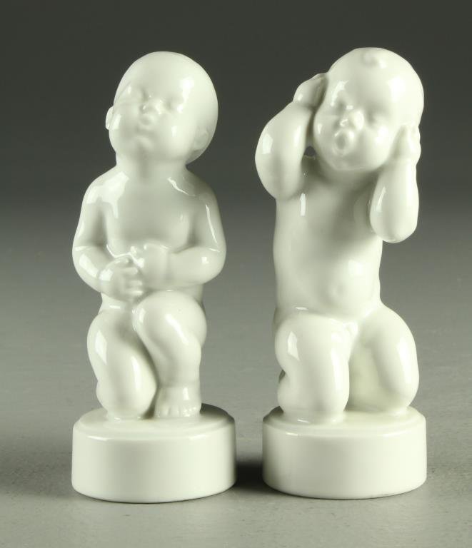 (2) Danish Bing and Grondahl Porcelain Figures: Two nude infants of white glazed porcelain raised on circular plinths, marked "B&G" in blue under glaze for Bing and Grondahl, both measure approximately 4.25"H, circa 20th century.