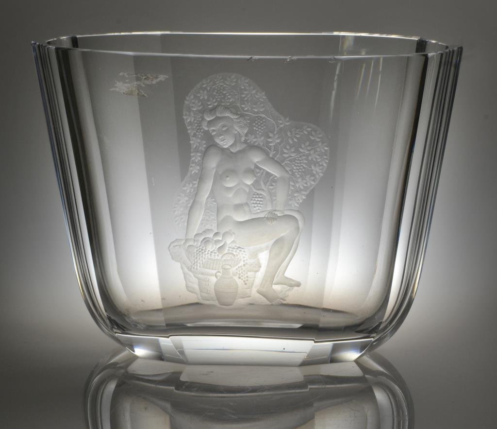 Nils Landberg One of a Kind Orrefors Etched Art Glass: A large, faceted vase etched to depict a nude with a basket of fruit, signed to base, "Orrefors, Landberg, Expo, 1646 AD, 1950", measures 9"H x 12.25"W, circa mid 20th century. Condition, having three