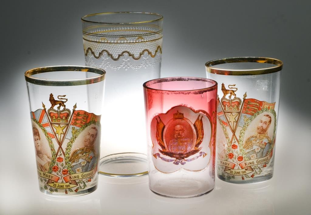 (4) Antique Hand Blown Gilt Glass Tumblers: To include a pair of Queen Mary and King George V tumblers, a cranberry and clear hand blown tumbler depicting Franz Joseph I of Austria and a large clear and gilt glass tumbler with floral swags, lar