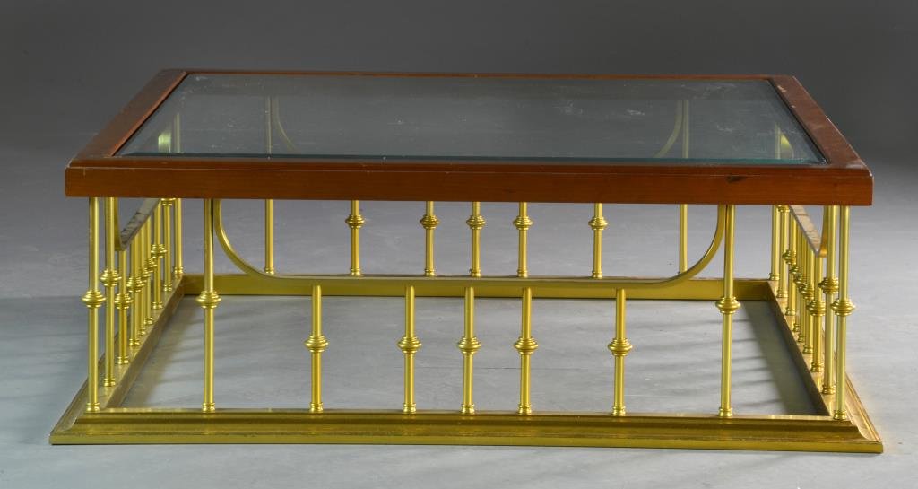 Brass and Glass Coffee Table: Beveled glass top with wood edge raised on pierced brass frame, measures 72"Sq., circa 20th century, very solid table, Condition, with scattered losses to wood area. Property of a Rochester Hills, Mic