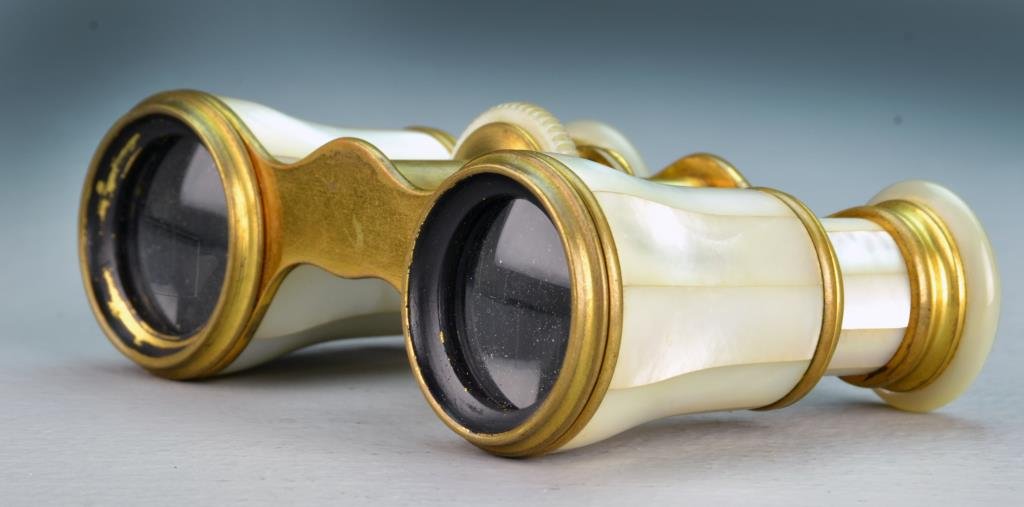 Pair. Lemaire French MOP Opera Glasses: In brass and primarily mother of pearl, signed to each of the eyepieces. Measures 3.5"W, circa early 20th century. Private Collection, Lake Orion, Michigan.
