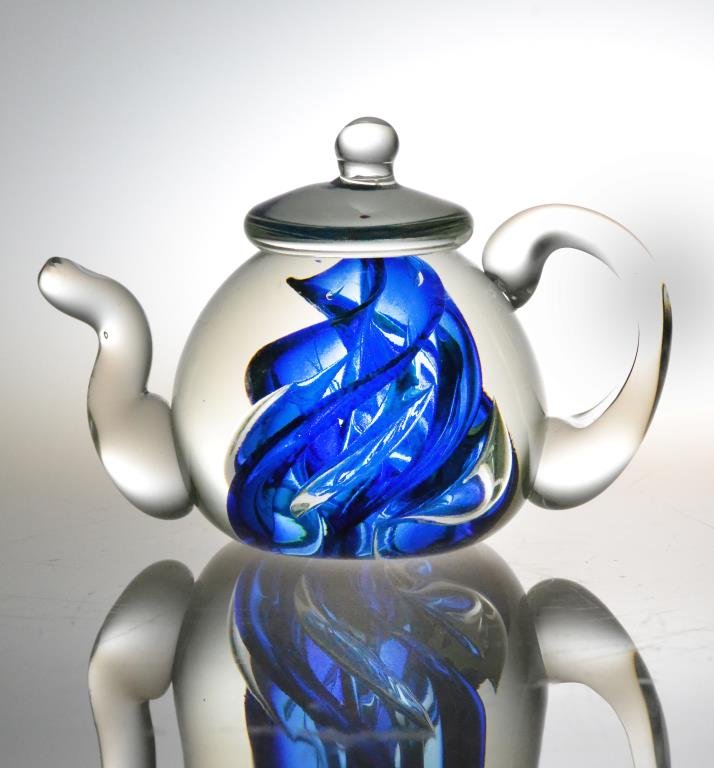 Lonsway Art Glass Teapot Paperweight: Crystal clear hand-blown teapot with cobalt swirl design inside, signed Longsway 98 on bottom, Brian Lonsway (1940-2001) a pioneer of Toledo's Studio Glass Movement, 3.5" H x 5" W. Condition: good. Th