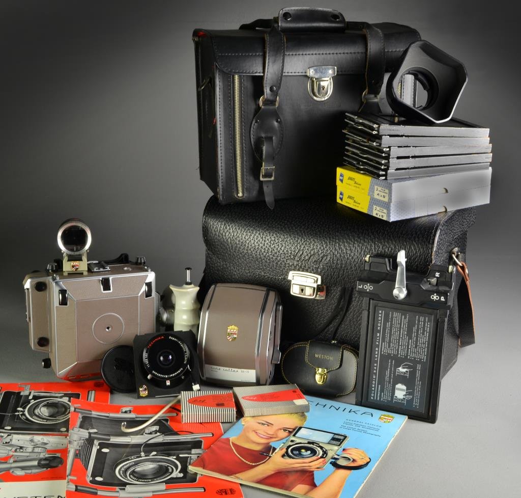 (10+) Pc Super Technika Linhof Camera & Accessories: To include a Linhof Super Technika large-format precision camera, in a fitted case, along with Weston light meter, a multi-focus optical view finder, additional working lens, film holders for a large 