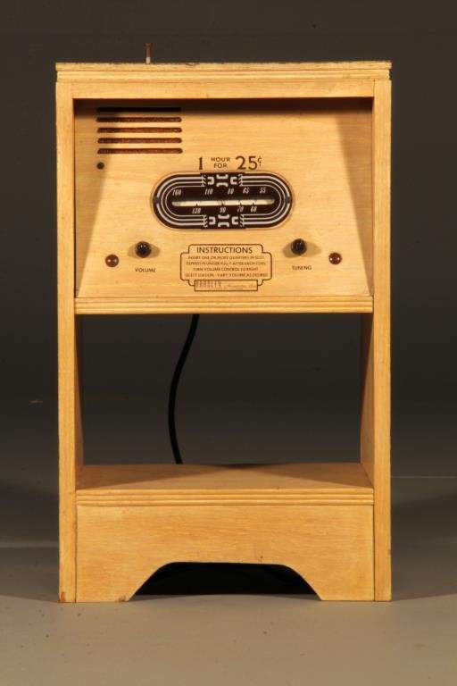 A Bradley 25 cent Radio: Having a laminated plywood case, it's original keys, unsure of working order, 24"H X 15"W X 13"D, circa 1950's. Key in customer file. Property of a Grosse Ille, Michigan collector.