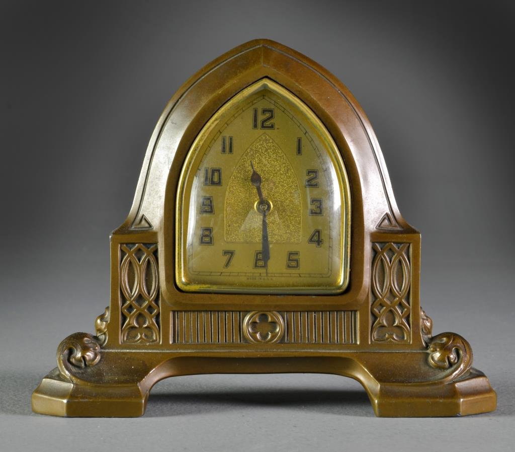 American Art Nouveau Spelter Shelf Clock: Of steeple form having molded floral and scroll decoration in high relief, 5.75"H, circa early 20th century.