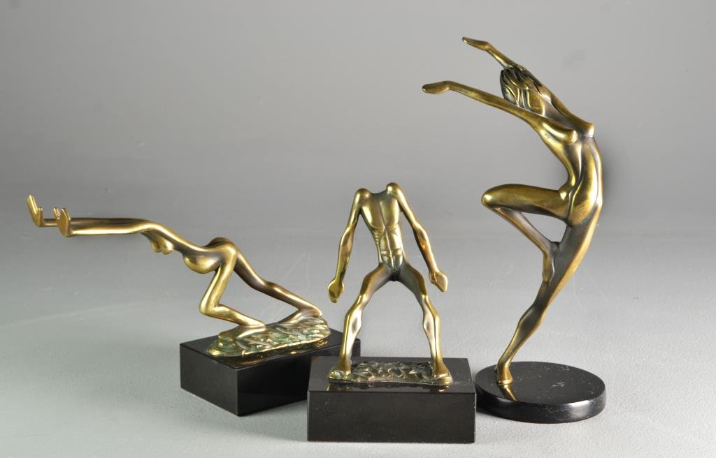 (3) Tom & Bob Bennett Bronze Figural Sculptures: To include cast bronze bookends in the form of a nude man and woman, the man signed for Tom Bennett 1981 and the woman B. Bennett 1981, along with a sculpture of a posed nude woman signed Tom Bennett