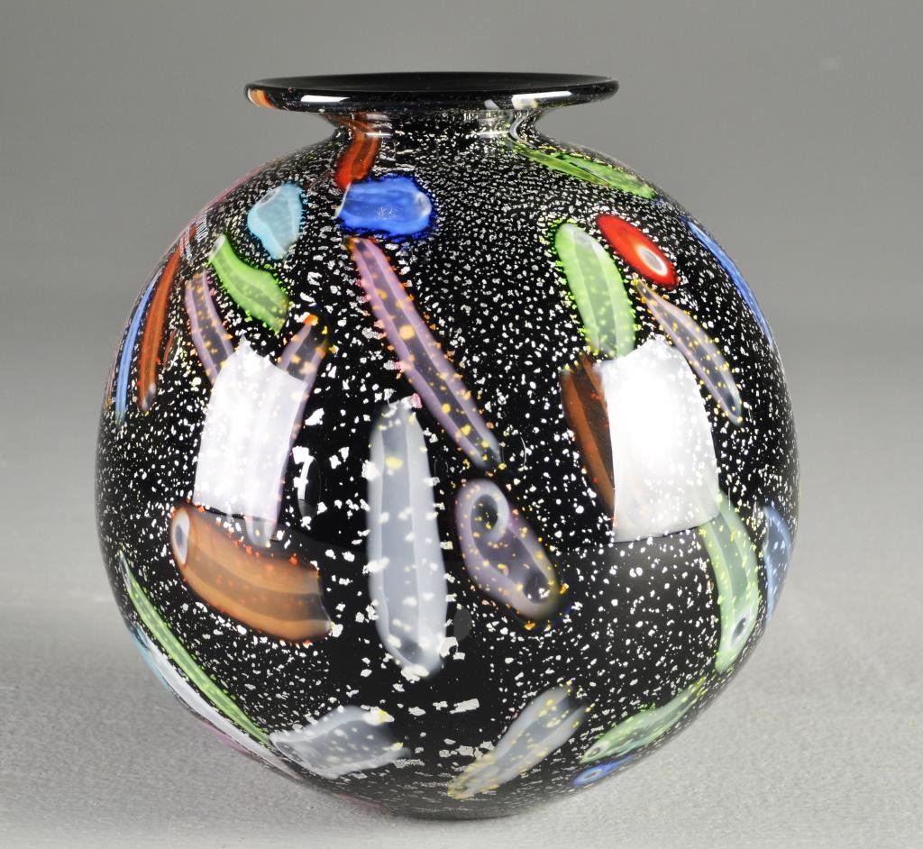 A Murano Art Glass Vase: Of globular form having colorful swatches and silver flake over a black ground cased in clear glass, having original label reading "Formia Ventri Di Murano Made In Italy", measures 7"H, circa 20th cen