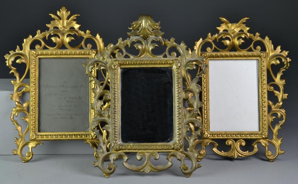 (3) Pcs. Victorian Cast Iron and Gilt Frames and Mirror: To include a near pair of gilt decorated picture frames having pierced leaf and scroll design, together with rectangular mirror housed in a beautiful gilt decorated frame having pierced and scroll des