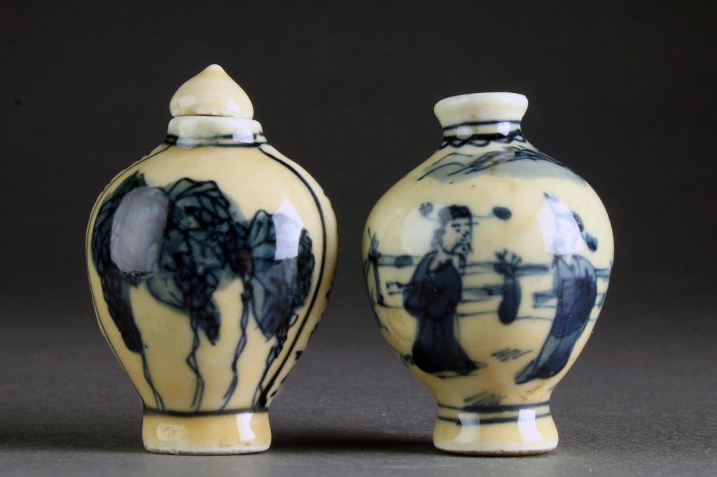 (2) Chinese Blue and White Porcelain Snuff Bottles: Two small blue and white porcelain examples, finely painted at center to depict cricket, bunches of grapes and figures in a landscape, one with a base marked by a blue leaf underglaze, tallest is 2.2"