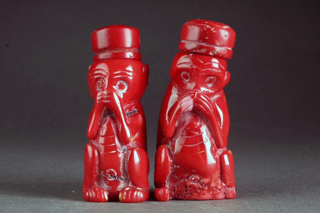 (2) Chinese Carved Coral Snuff Bottles: Two finely polished coral examples carved to depict "speak no evil" monkeys, complete with matching coral stoppers and spoons, tallest is 2.5"H.