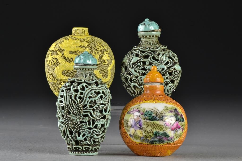 (4) Chinese Famille Rose Porcelain Snuff Bottles: Comprised of two similar turquoise colored examples depicting foo dogs, dragon and phoenix, another with a molded yellow surface depicting a five clawed dragon among ruyi clouds, together with a round