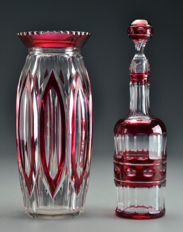 (2) Pcs Antique Cranberry Cut to Clear Glass: To include an open vase and decanter with ball finial, both unsigned, largest measures 13'H, circa late 19th-early 20th century. Condition: decanter with chipped rim. Property of a Birmingham, MI fami
