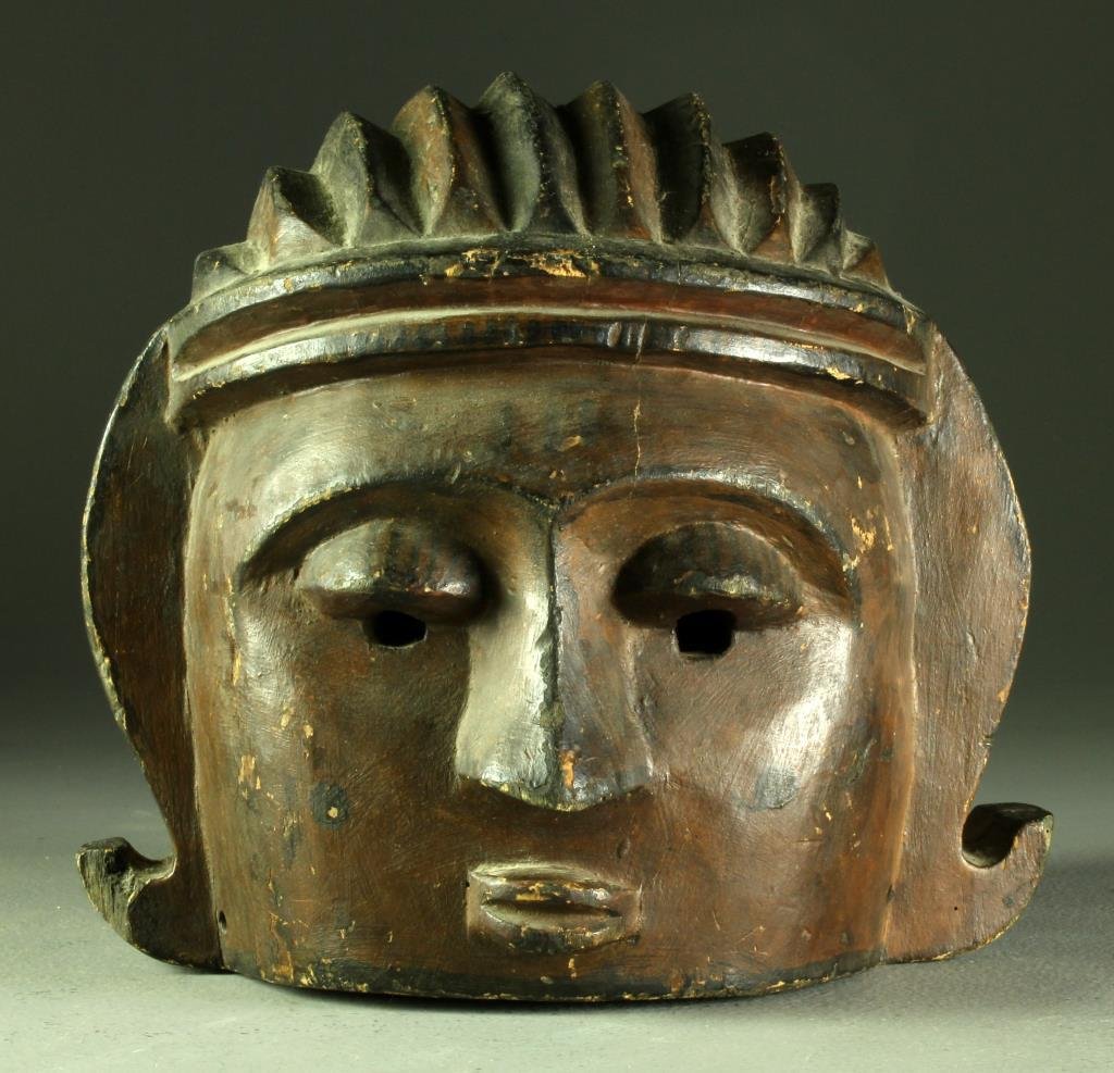 Antique Carved African Mask: In the Cubist style, having black and red painted details, measures 10.25"H x 10.5"W x 11"D, circa late 19th-early 20th century.