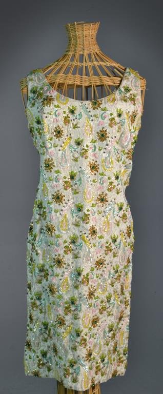 A Ladies Silk Beaded & Sequined Dress: With gold thread embroidery, and looped beading and sequin pattern, tag reads "Made Expressly for Regalia Imports, In the Crown Colony of Hong Kong", 50% silk, 50% rayon, size 14, Made in Hong Kong, h