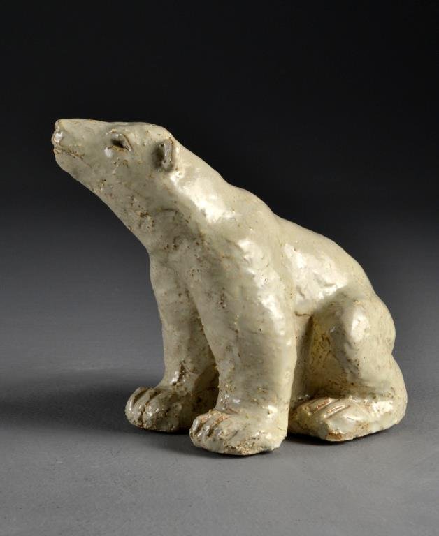 Rookwood Artist Laurie Abel Pottery Bear: Molded to depict a polar bear, having a matte cream glaze, signed Laurie Abel to the underside. 8"L, circa early 20th century.