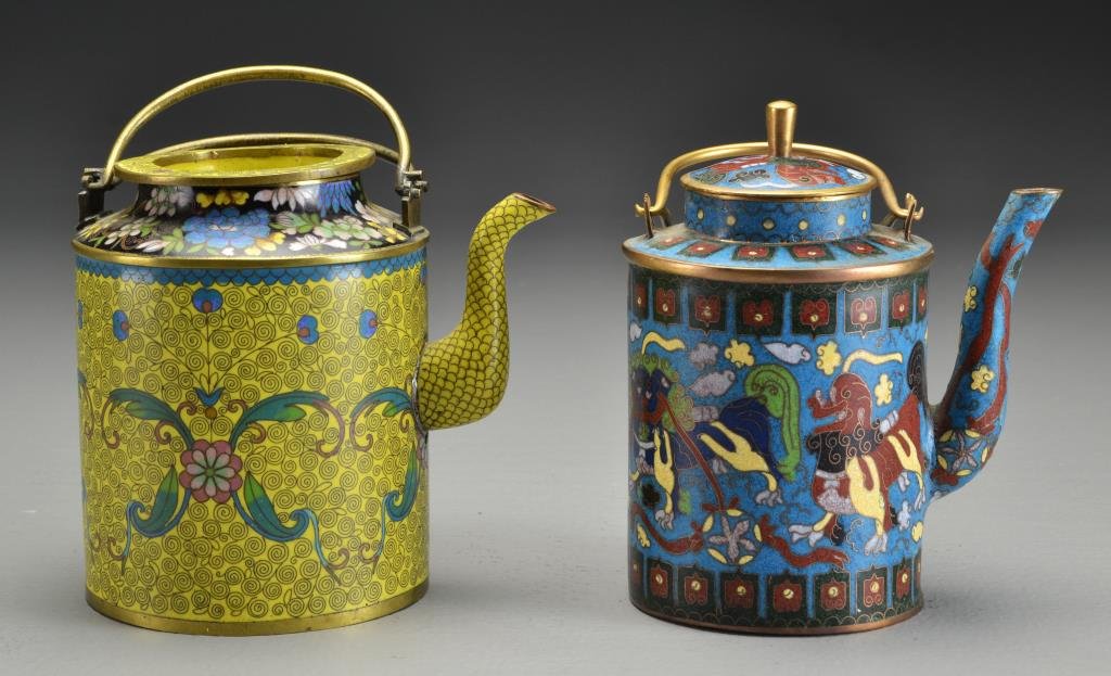 (2) Chinese Cloisonné Teapots: Bodies of cylindrical shape, one finely enameled to depict foo dogs among ruyi clouds against a turquoise ground, underside of base with impressed four character seal, together with a yellow ground ex