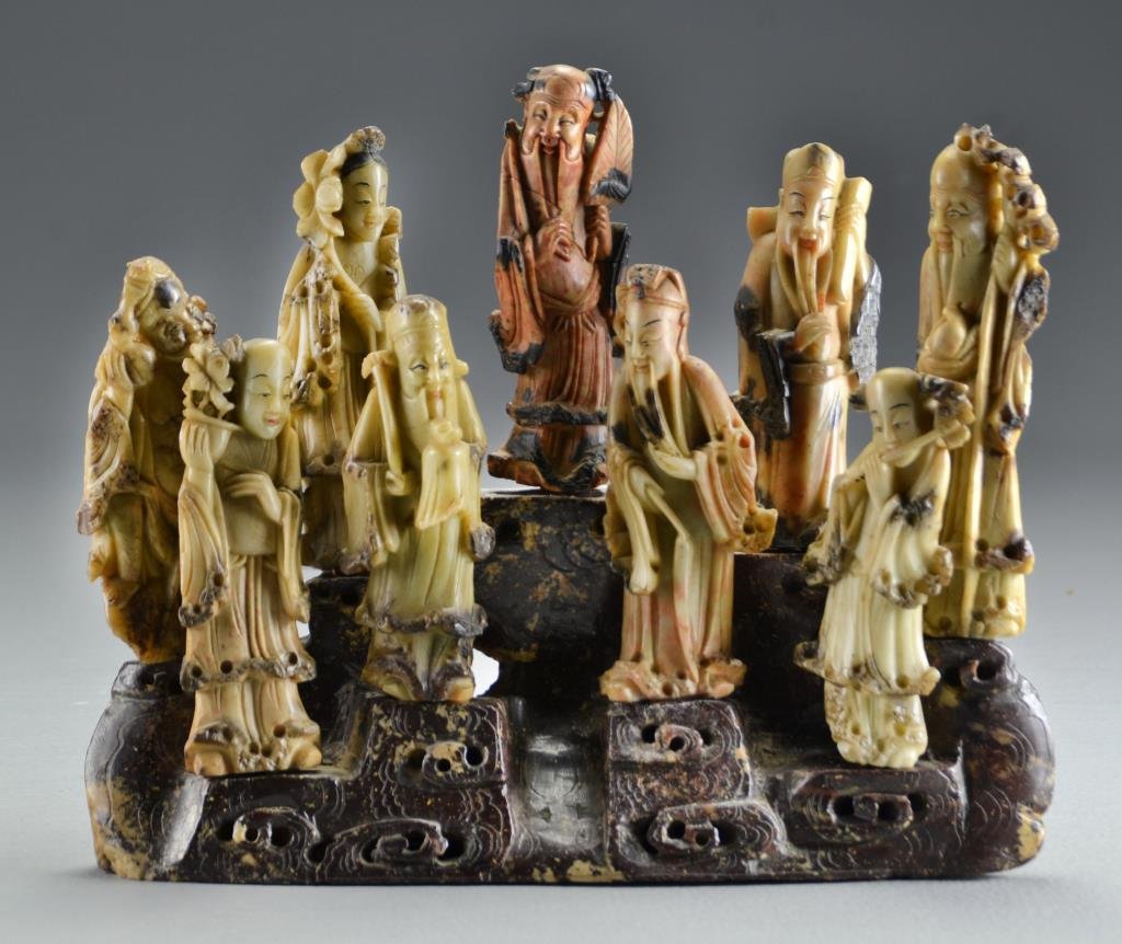 (7) Chinese Qing Carved Soapstone Lucky Gods: Depicting the seven lucky gods, all having ink decorated highlights, all finely carved and polished and displayed on original soapstone stand, having wood peg mounts, average figure measures 5"H not i