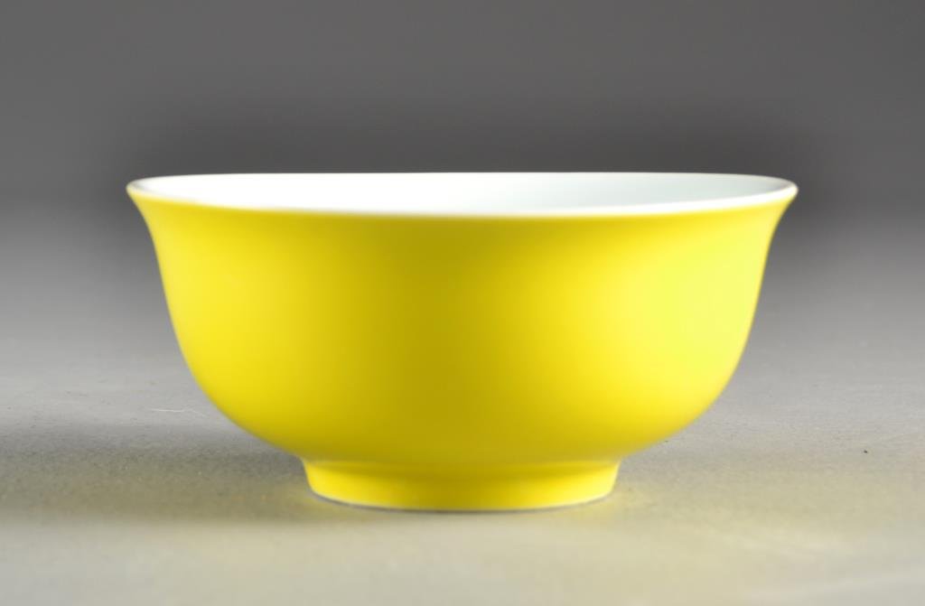 A Chinese Lemon Yellow Porcelain Bowl: Having a flared rim and short foot, having an unusual five character seal mark to underside, measures 5.375"Dia.