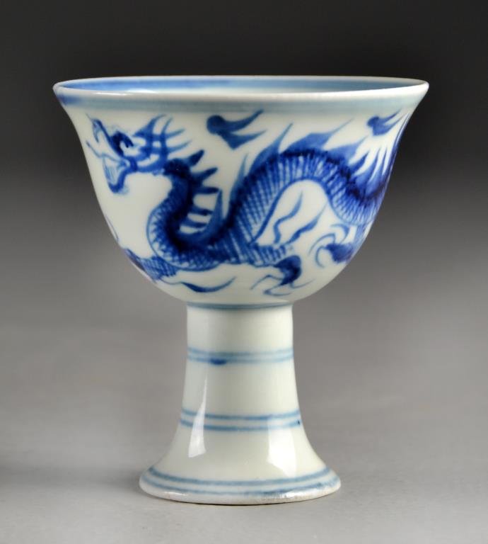 A Chinese Blue & White Porcelain Wine Cup: Having a five clawed dragon chasing a flaming pearl, with a six character seal mark in underglaze blue to inside of footring, measures 3.375"H.