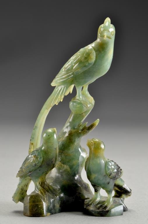 Chinese Qing Carved Jade Figural Grouping: Finely carved to depict a hawk and its offspring on a rocky outcrop, the stone a spinach green with black inclusions, well carved and polished, measures 5.75"H, circa late 19th-early 20th century. Pro