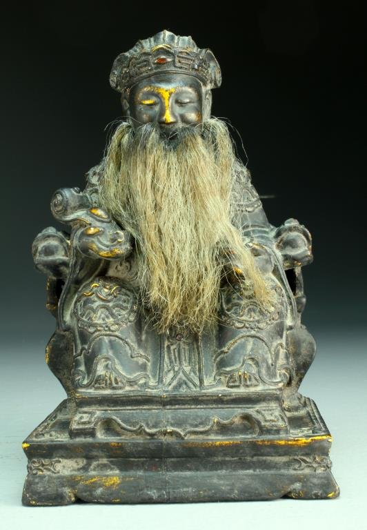 Chinese Qing Carved Gilt Wood Figure: Carved to depict an elder, possibly an Emperor, seated on a throne holding a ruyi scepter in one hand and a dish in the other, wearing elaborately carved robes, his beard made from actual hair, appare