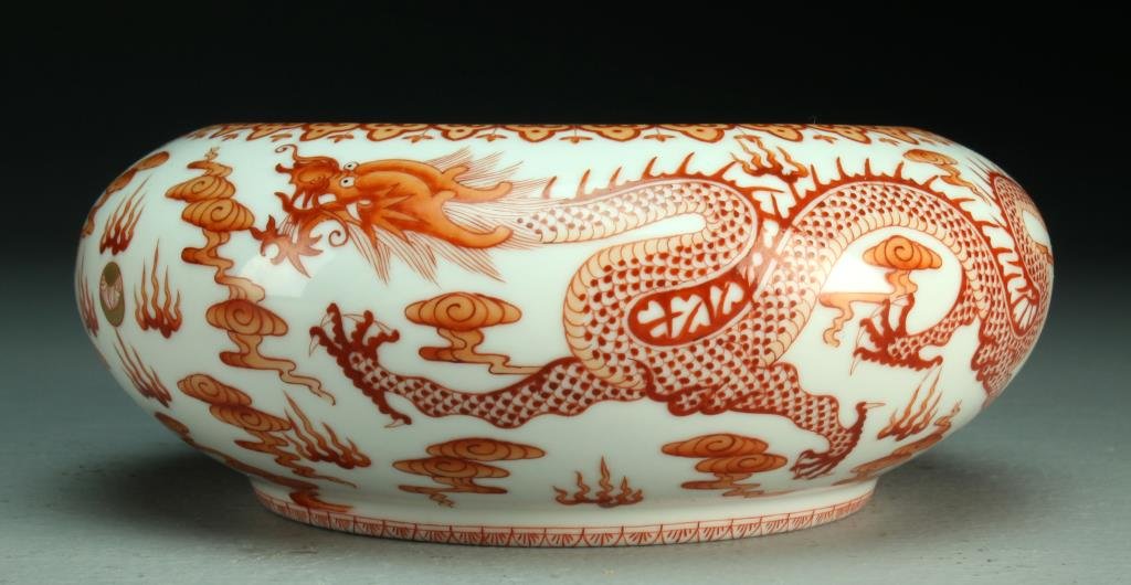 Chinese Republic Iron Red & White Brush Wash: Finely painted to depict five-clawed dragons chasing a flaming pearl, raised on short foot ring, base having six-character Guangxu mark in underglaze iron red and possibly of the period, 2.5"H X 6.25"