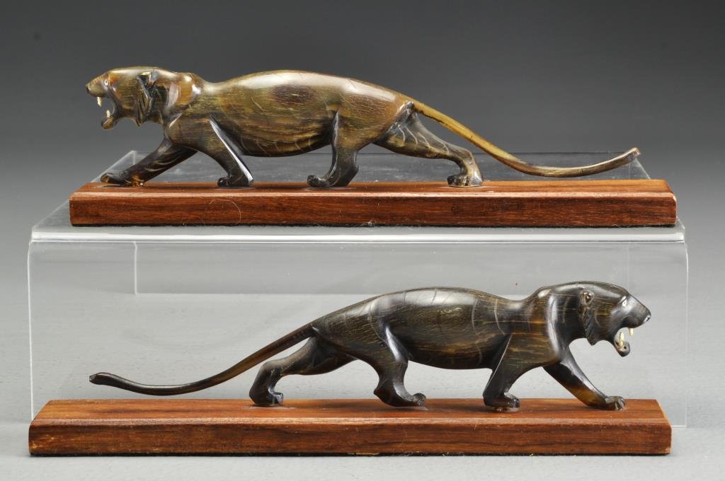 Pr. Chinese or Japanese Carved Horn Tigers: Both raised on carved wood display stands, tigers measure 8.5"L, overall 9"L, circa early 20th century. Property of a Birmingham, MI family.