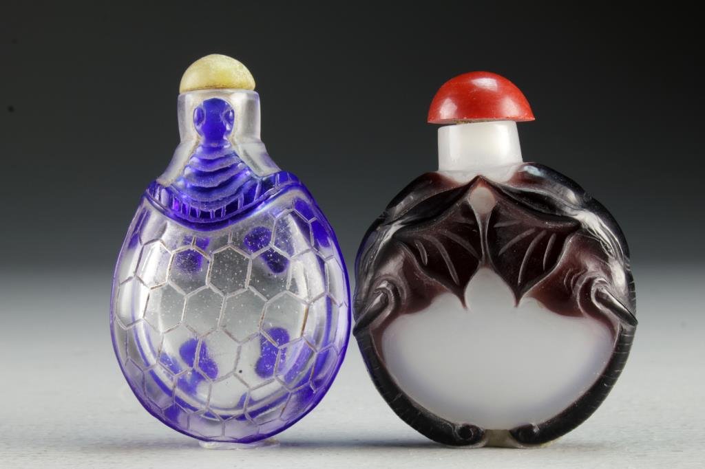 (2) Chinese Peking Glass Snuff Bottles: One formed as turtle with carved details on shell, other having opaque glass with elephant head to sides, largest is 2.9"H.