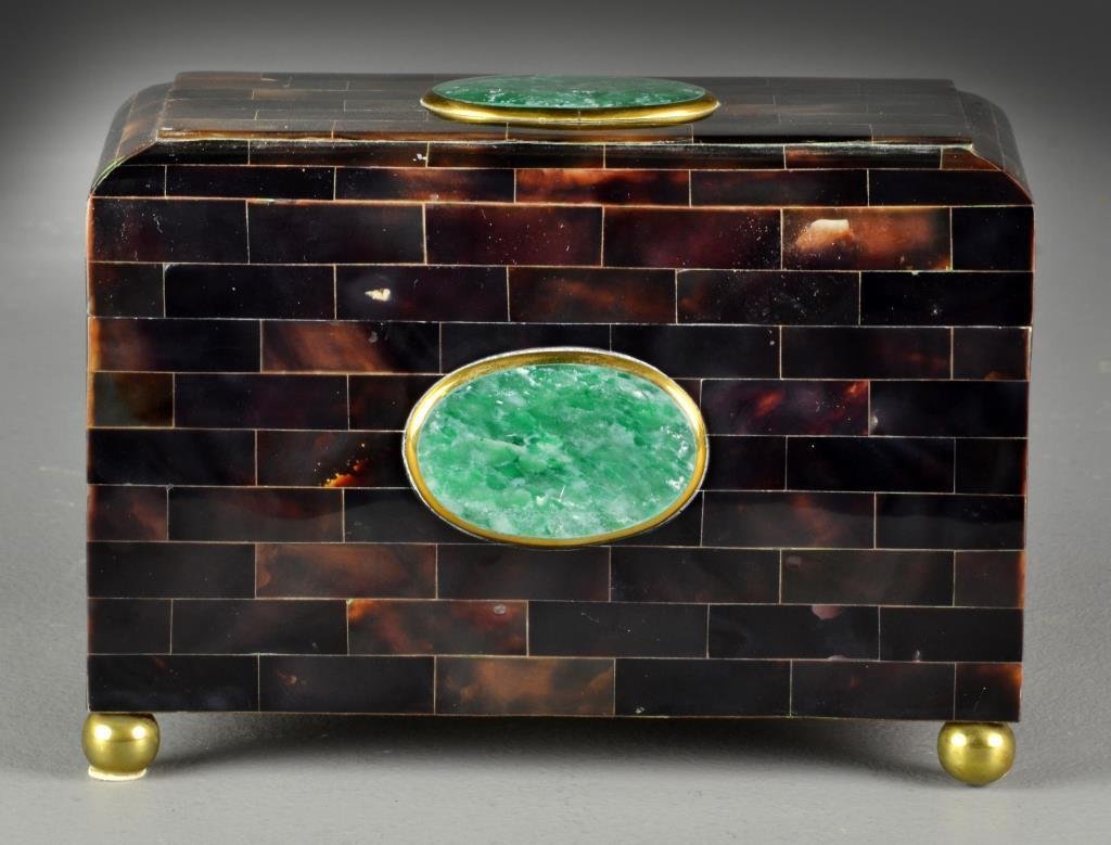 A Maitland Smilt Stone Inlaid Covered Box: Tessellated and faux tortoise shell hardstone inlaid covered box, raised up on four brass ball feet, bottom bearing original Maitland Smith tag, 6.25"H X 9"W X 4.5"D. Property from Ethel Miller Siegel