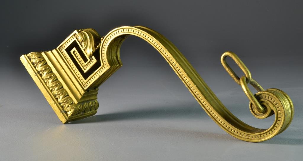 Antique Gilt and Cast Bronze Wall Hook: Having two stationary chain links on a pierced rectangular scroll hook with ecanthus leaves in high relief, measures 13"H, circa early late 19th-20th century. Condition, with loss to gilt and light ov