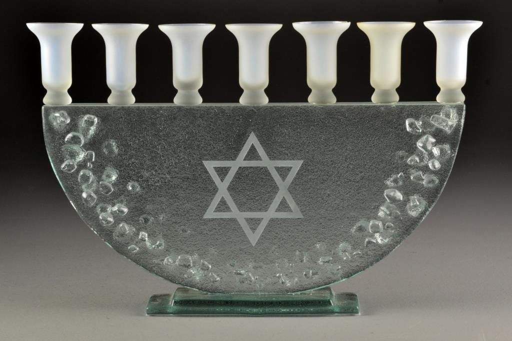 A Large Art Glass Menorah: Having seven satin glass candle holders raised on unique textured glass half circle form with etched Star of David and stepped rectangular base, measures 10.75"H x 15.5"W, circa 20th century. Conditio