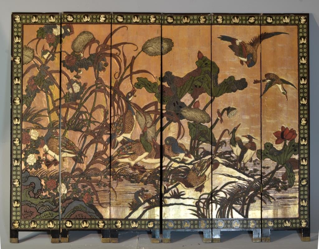 Chinese Qing Coromandel Six-Panel Lacquered Screen: A six panel carved folding screen, lacquered and polychrome painted in depiction of mandarin ducks among foliage with heavy gold accents to one side, reverse depicting deer beneath a cherry blossom an