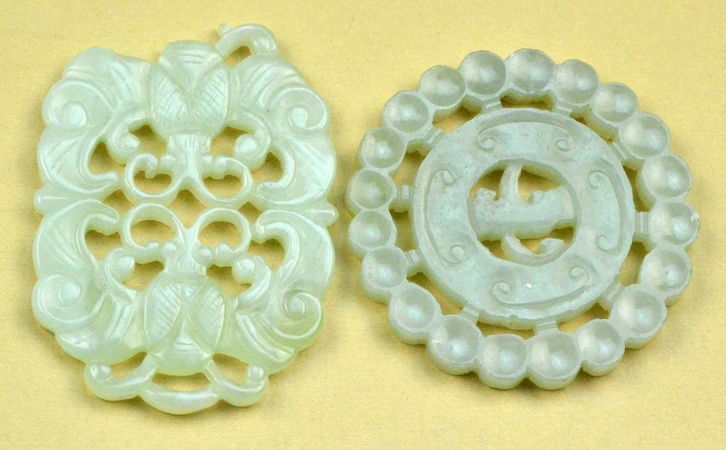(2) Chinese Qing Carved Jade Plaques: One carved as opposing bats the other carved in the archaic style, largest is 2.5"L, circa 20th century. Condition: One with break. Property of a Rochester Michigan Gentleman.