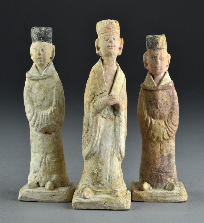 (3) Chinese Archaic Painted Earthenware Tomb Figures: To include three male figures wearing hats and robes, all having polychrome painted decoration, raised on square bases, largest measures 7.75"H, circa Tang dynasty or earlier. Condition, all having ov