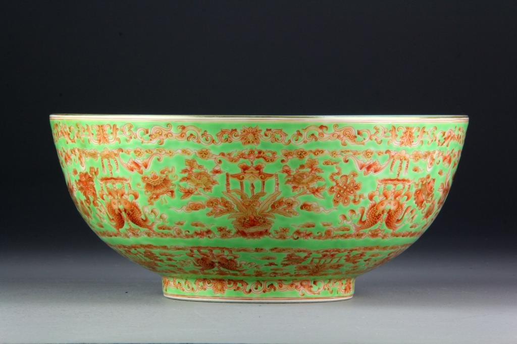Large Chinese Famille Rose Porcelain Bowl: Finely painted in iron red with gilt highlights to depict Buddhist symbols with lotus blossoms and scrolling tendrils, interior and base with turquoise glaze, raised on short foot ring, base with seal