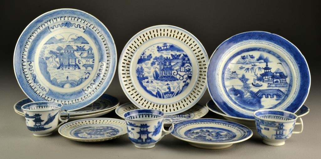 (14) Pcs. Chinese Blue & White Canton Porcelain: To include seven plates, some reticulated, two shallow bowls, three cups, and a sauce boat and undertray, all decorated with landscapes, pagodas, and decorateive borders, largest measures 9.75"D, circ