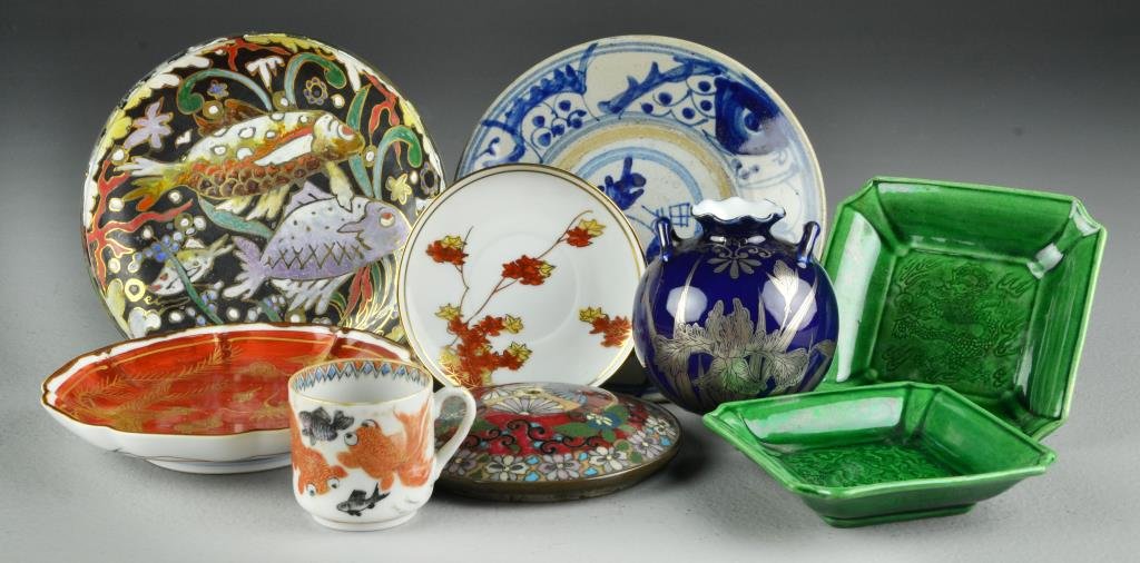 (9) Chinese and Japanese Porcelain Items: To include a Japanese cobalt and silver overlay vase, two iron red and gilt plates, Japanese blue and white ironstone plate, porcelain demitasse cup with goldfish, two Chinese green glazed plaes with 