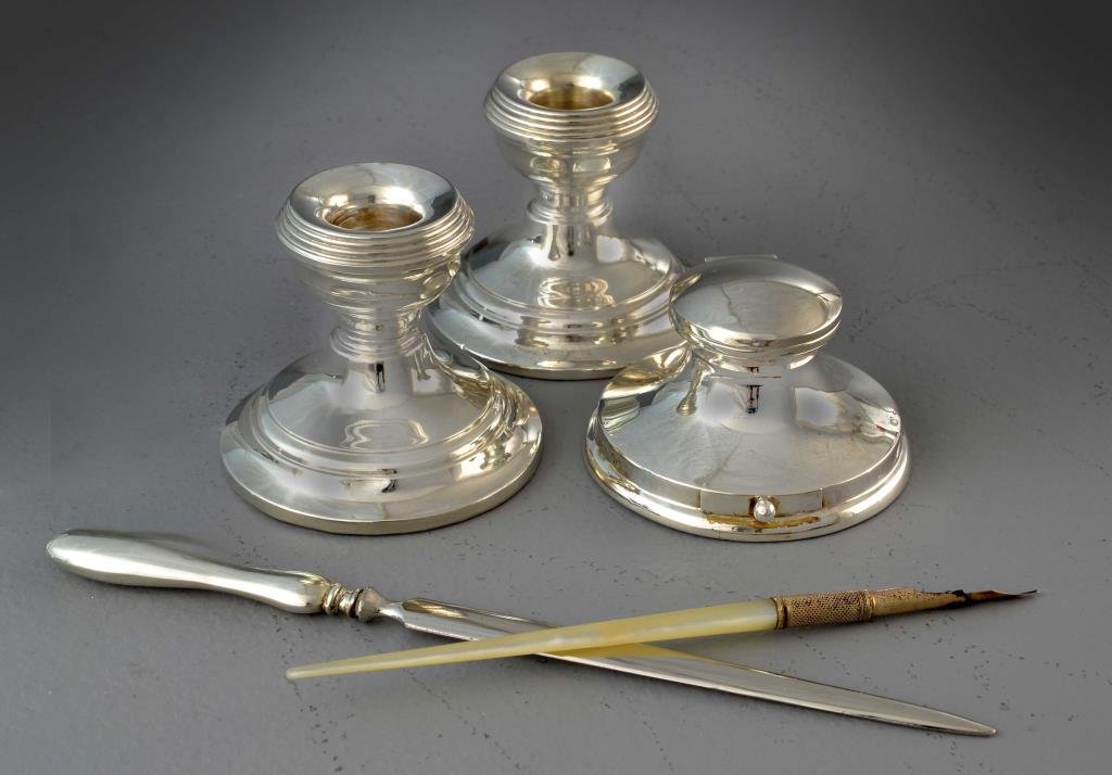 (5) Piece Henry Clifford Davis Sterling Silver Writing: Comprising of an inkwell, two candlesticks and a letter opener all Sterling Silver bearing H.C.D. and other hallmarks for Henry Clifford Davis, set also includes a marked "Solid Gold" tipped calligrap