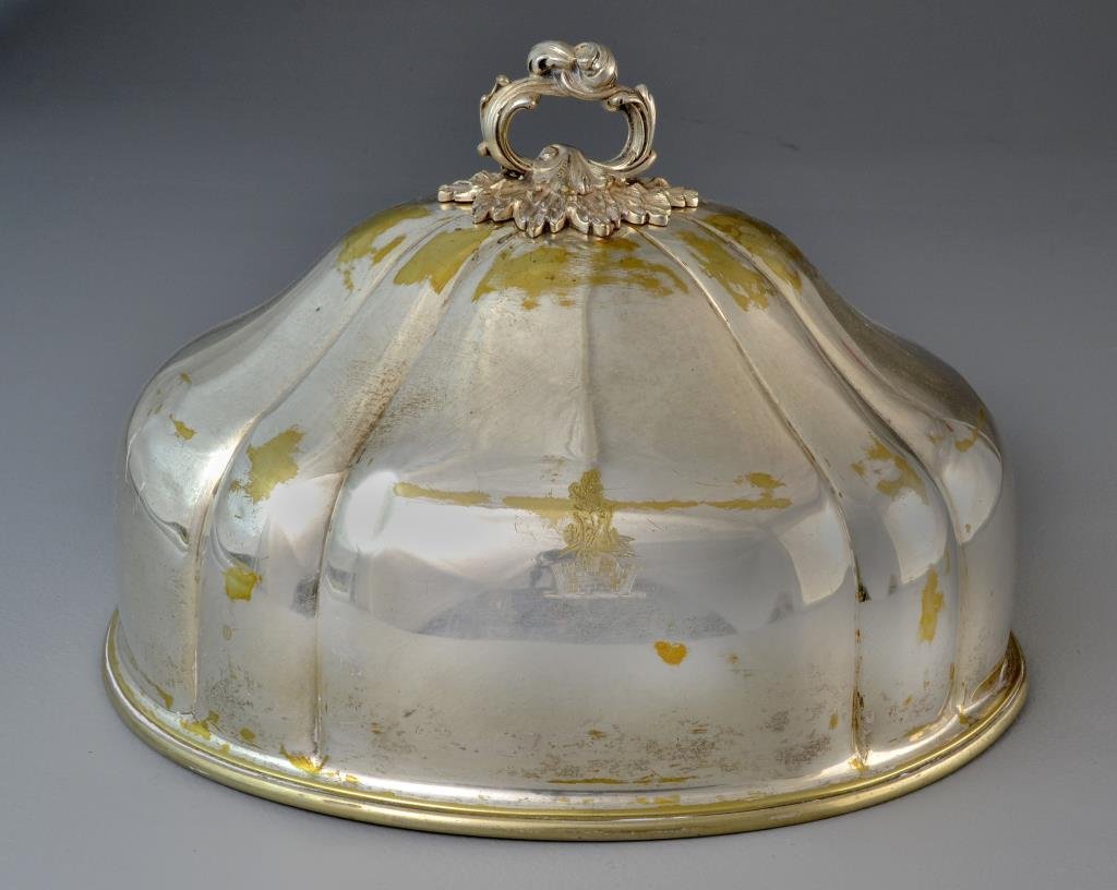 An Old Sheffield Plate Meat Cover: A fine plated example, having heavily embossed and scrolled handle, paneled body having gold washed engraving with stone wall and floral motif, interior marked with the number 3, measures approximatel