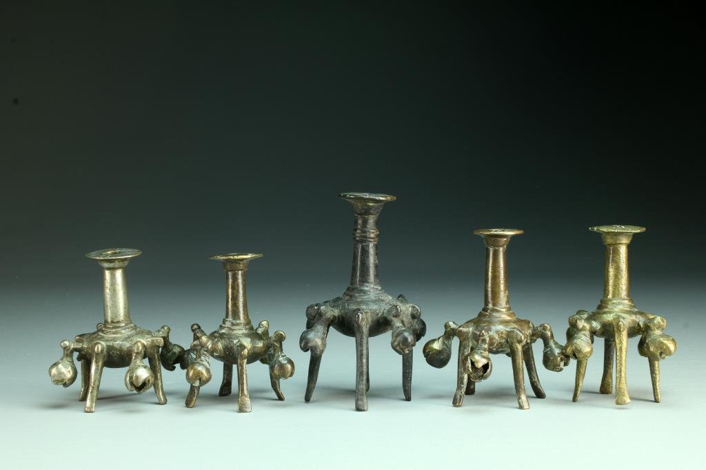 (5) Early Persian Bronze Kohl Vessels: To include five bronze footed vessels with four encased bronze balls to sides, used for kohl eye cosmetics in the Greater Persian region, possibly originating from Afghanistan, largest measures 5.25"H