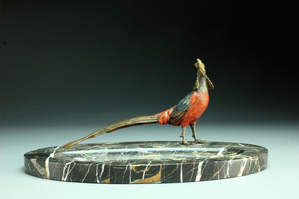 An Antique Austrian Bronze and Marble Centerpiece: Having a polychrome painted bronze pheasant mounted on a marble tray with oval reservoir, marble having an attractive veining, the phaesant well cast and boldly painted, phaesant measures 9.5"L, overa