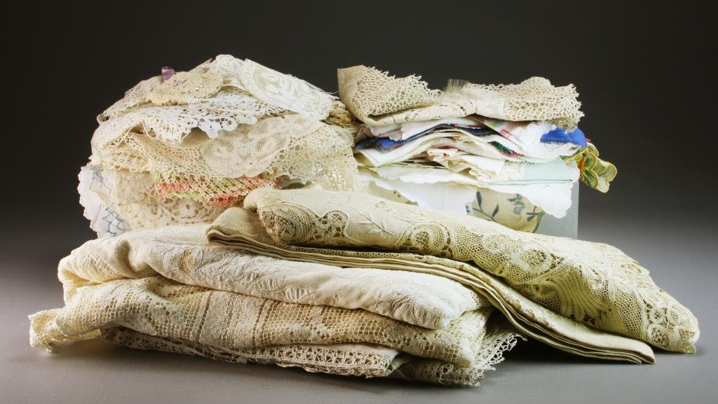 Large Collection of Antique Lacework & Textiles: Comprised of head scarves, handkerchiefs, tablecloths, napkins, table runners, doilies, trim and others, including lace work and silk, circa early-mid 20th century. Property of a Birmingham Michigan F