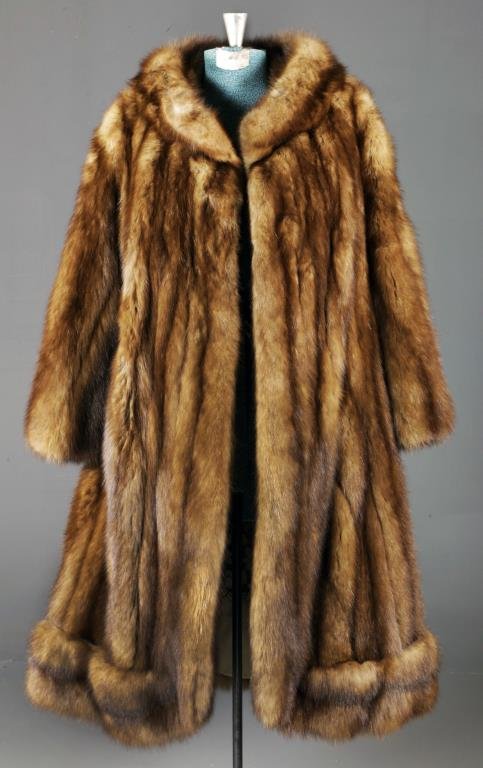 A Ladies Furs by Nathan Mink Coat: Beautiful chocolate brown mink coat, satin lined with open work floral motif, retailed by Furs by Nathan, Detroit, New York, closes with two hidden clasps to front, measures 42"L overall, 21" sleeve l