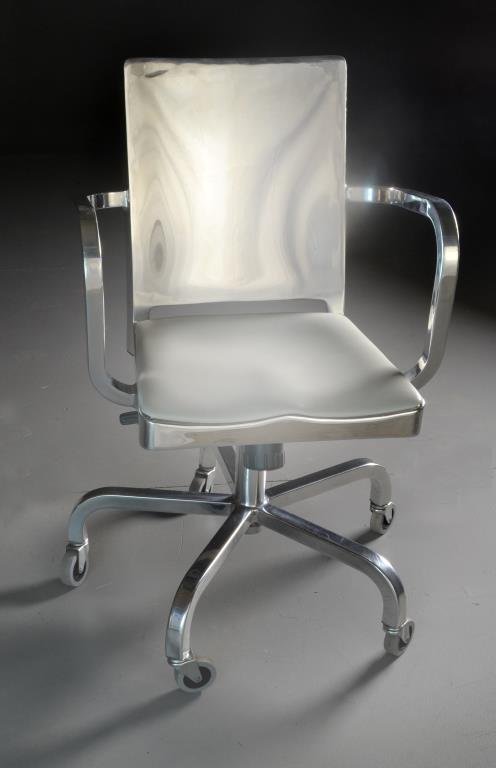 Emeco Hudson by Starck Aluminum Desk Chair: An aluminum swivel desk chair, having an off-white leather seat, five wheeled, height adjustable, marked Emeco by Starck. French designer Philippe Starck created and named this model for the Hudson Ho