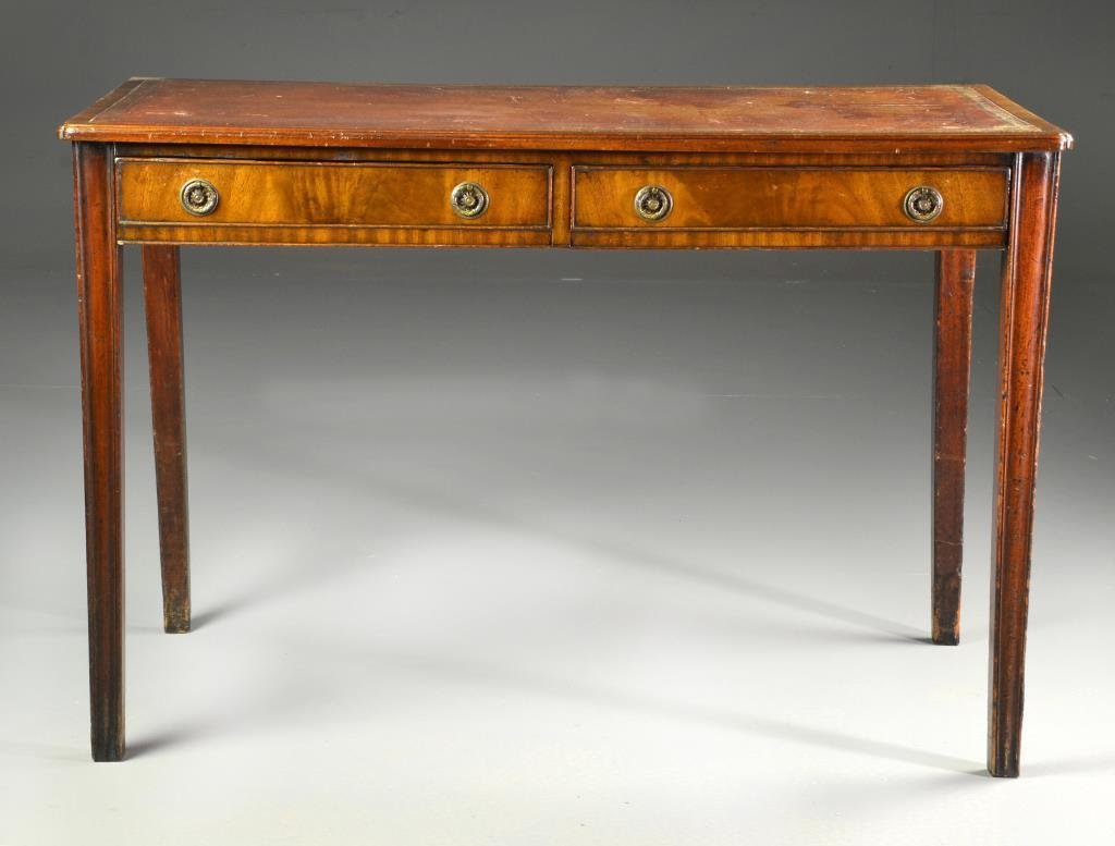 Antique English Chippendale Two Drawer Writing Desk: Having its original inset gilt embossed leather writing surface above two hand dovetailed drawers with pressed brass pulls raised on straight legs, circa 19th century, 28.5"H x 42.5"W x 22.5"D. Condit