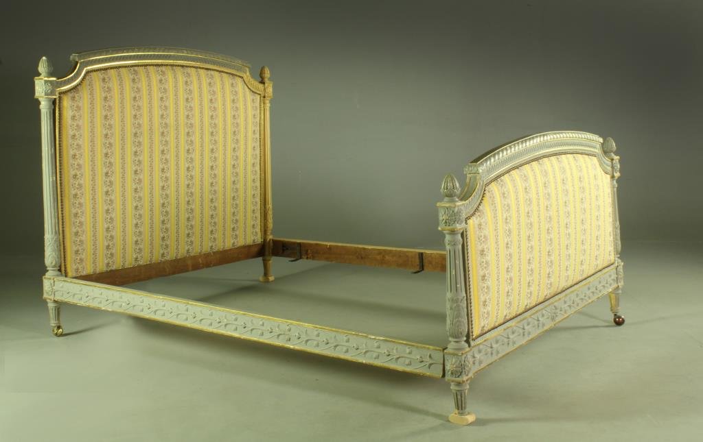 A 19th C. Italian Carved and Parcel Gilt Bedsted: Head and footboards having shaped molded crests with gilt decoration, having tapestry upholstered head and footboard in yellow and floral decoration surrounded by its original brass tacks, flanked by 