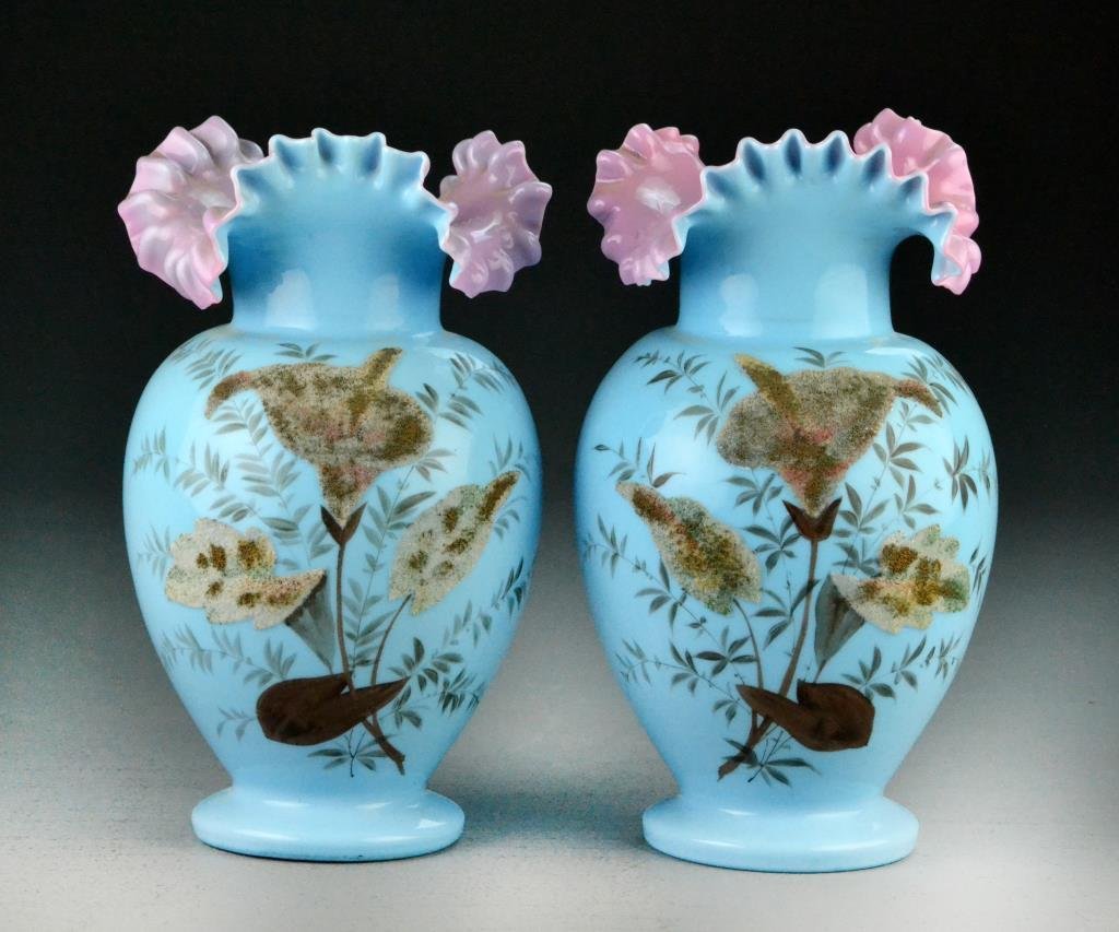 Pair Bristol Blue & Pink Glass Fluted Vases: Hand painted depicting floral decoration, exterior is pale blue with pink rippled collar, pontil mark to bottoms, 9" H, circa late 19th century. Condition: good, no chips or cracks. Trust of Ethel Sie