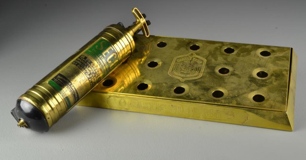 (2) Pcs Brass Pub Drip Tray & Fire Extinguisher: To include a brass pub beer drip tray marked Castle Eden Ale to front edge and center of tray, 16.5"W, along with a Seco brand fire extinguisher with made in Detroit, MI, 14.5"H, circa early 20th cent