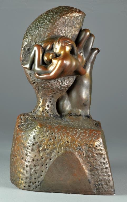 Austin Products Modernistic Sculpture: Molded to depict inter-twined nudes held by a hand on a naturalistic base, 20" H, circa mid 20th century. Property from Ethel Miller Siegel Trust, Bloomfield Hills, Michigan.